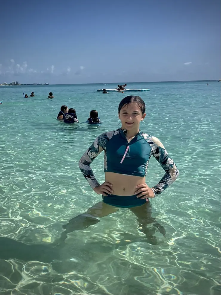 Ruby standing in clear turquoise sea water