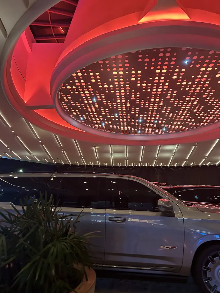 The arena's red ceiling lights on the way out
