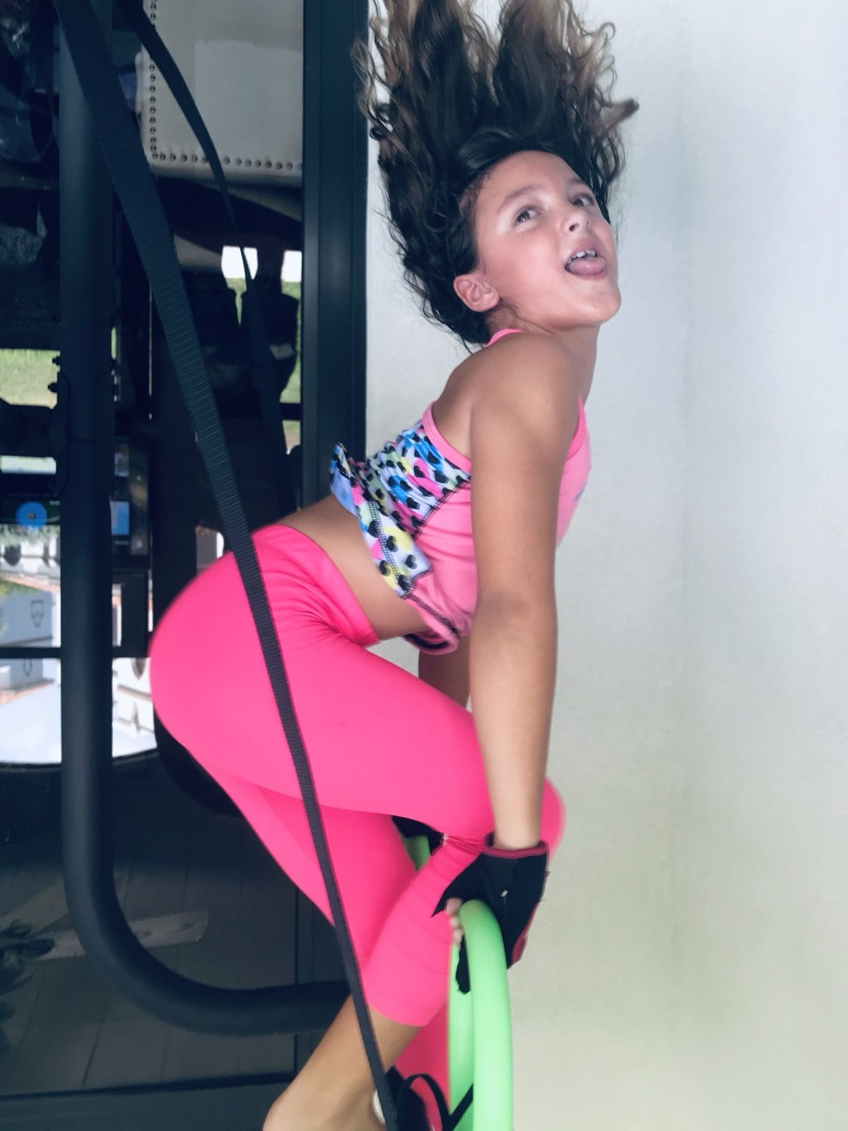 Ruby mid-workout in bright pink