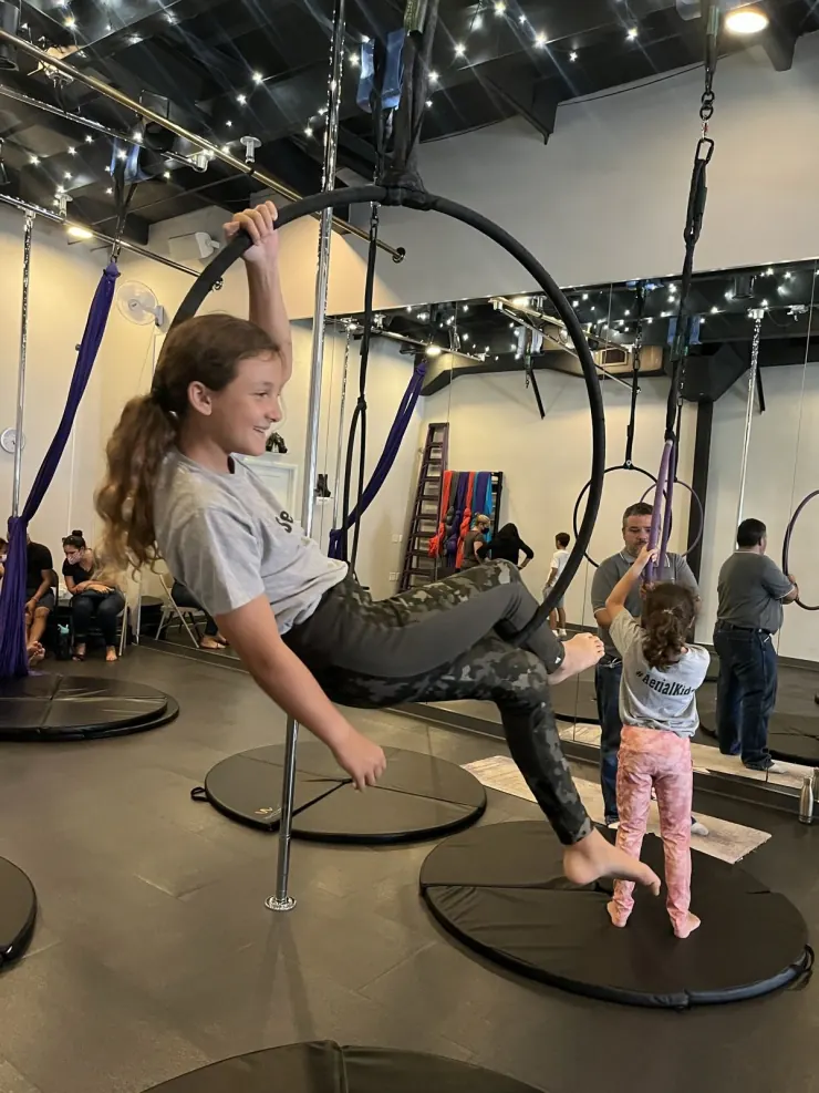 Ruby in an aerial hoop class