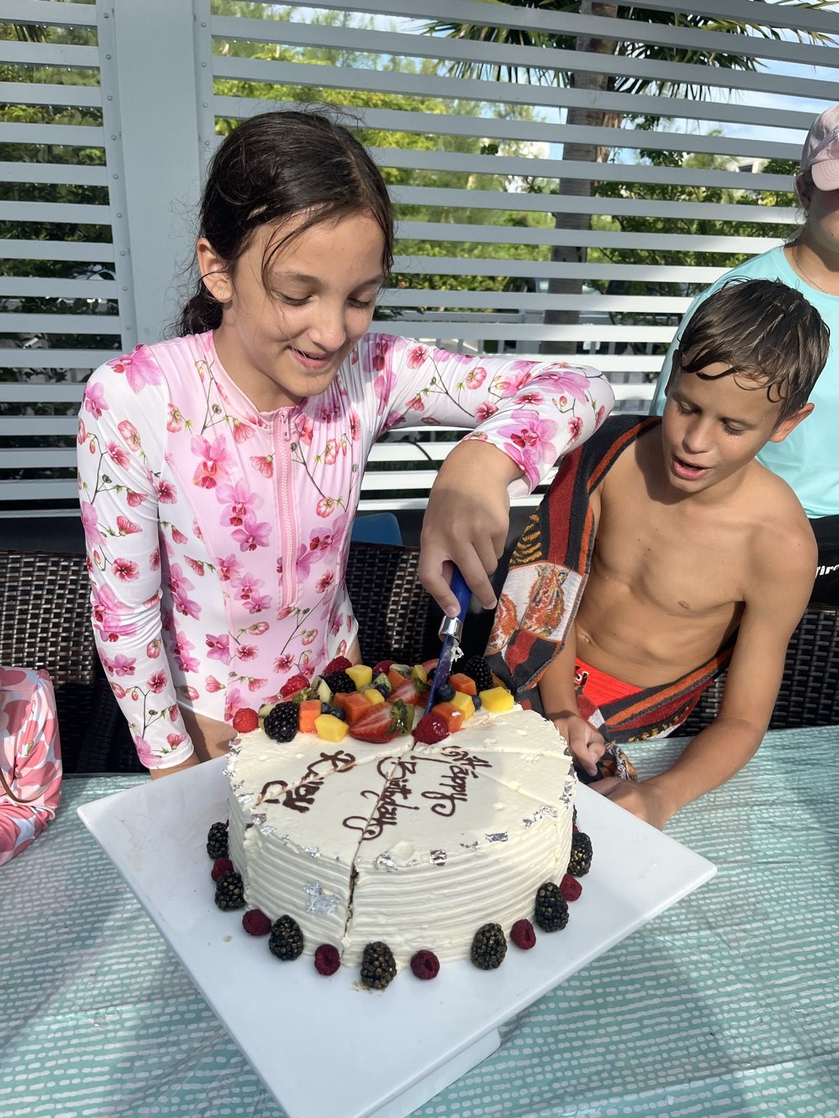 Ruby and her brother with a birthday cake