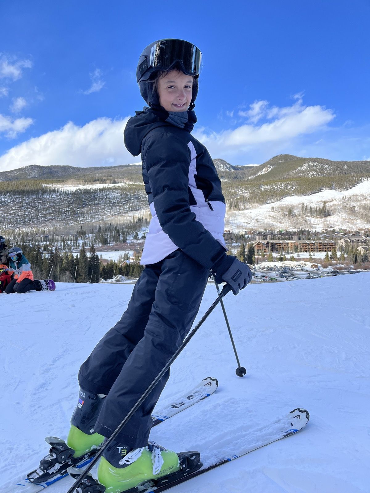 Ruby on skis against a blue Keystone sky