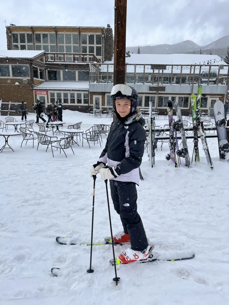 Ruby with poles in the ski village
