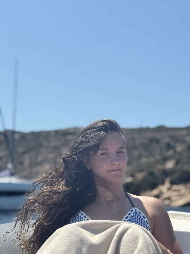 Ruby at the beach, hair in the wind