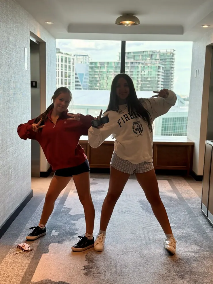 Ruby and a friend mid-dance in the hotel room