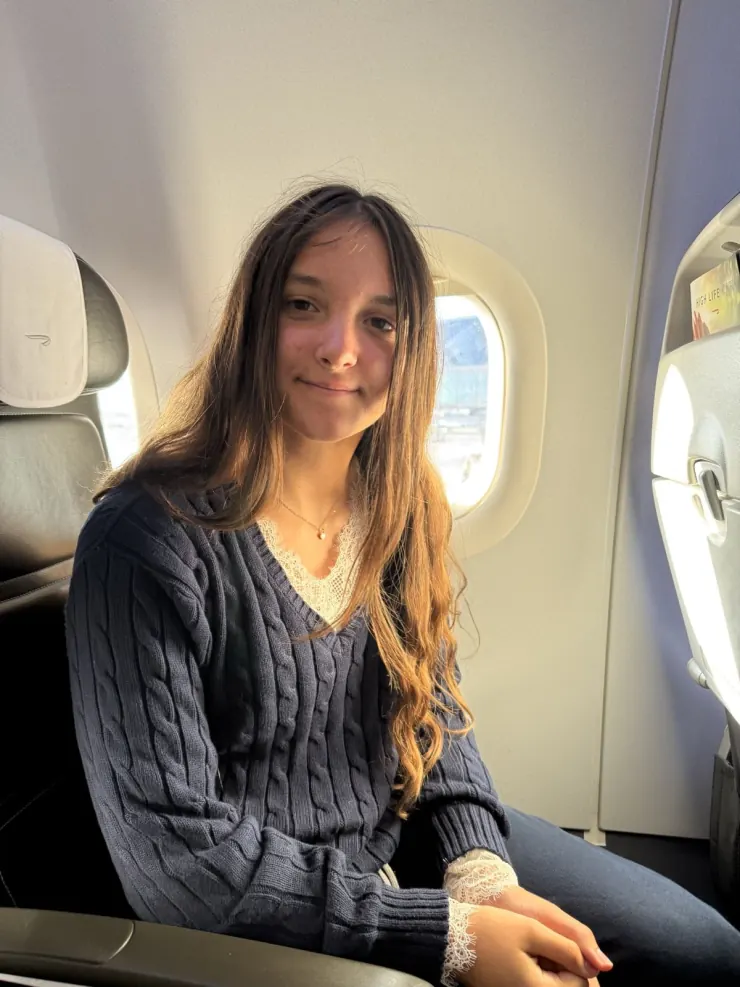 Ruby in her seat on the flight over