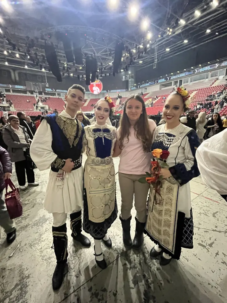 Ruby with the folk dancers who performed at the concert, still in costume