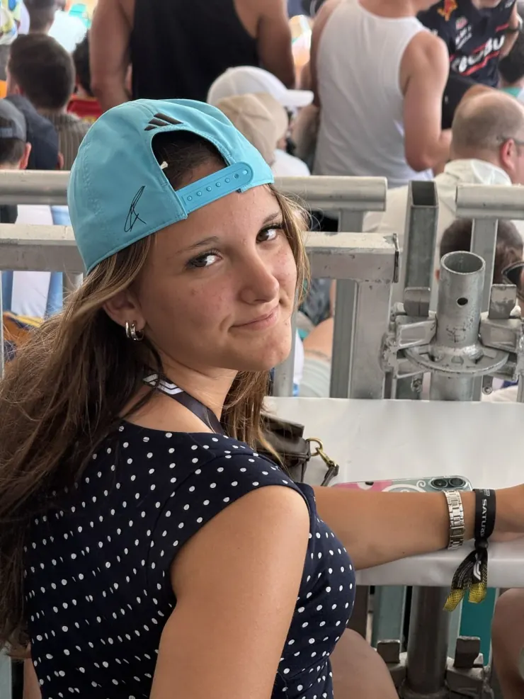 Ruby in a Mercedes cap at the circuit