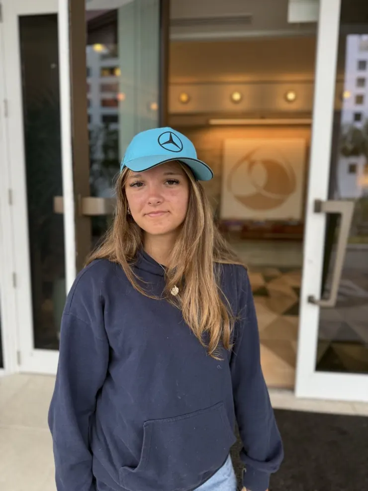 Ruby in a Mercedes cap on race weekend