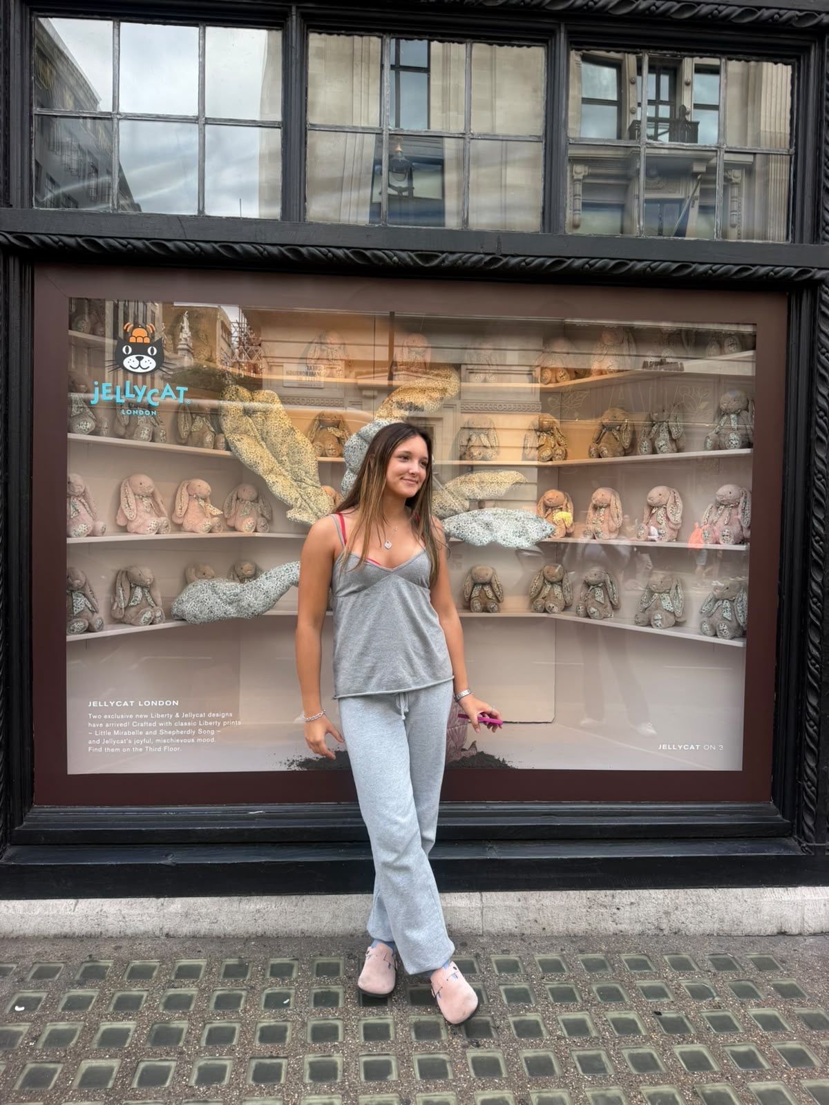Ruby in front of a Fifth Avenue store window