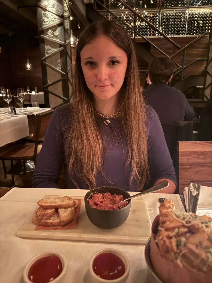 Ruby at a restaurant table for dinner